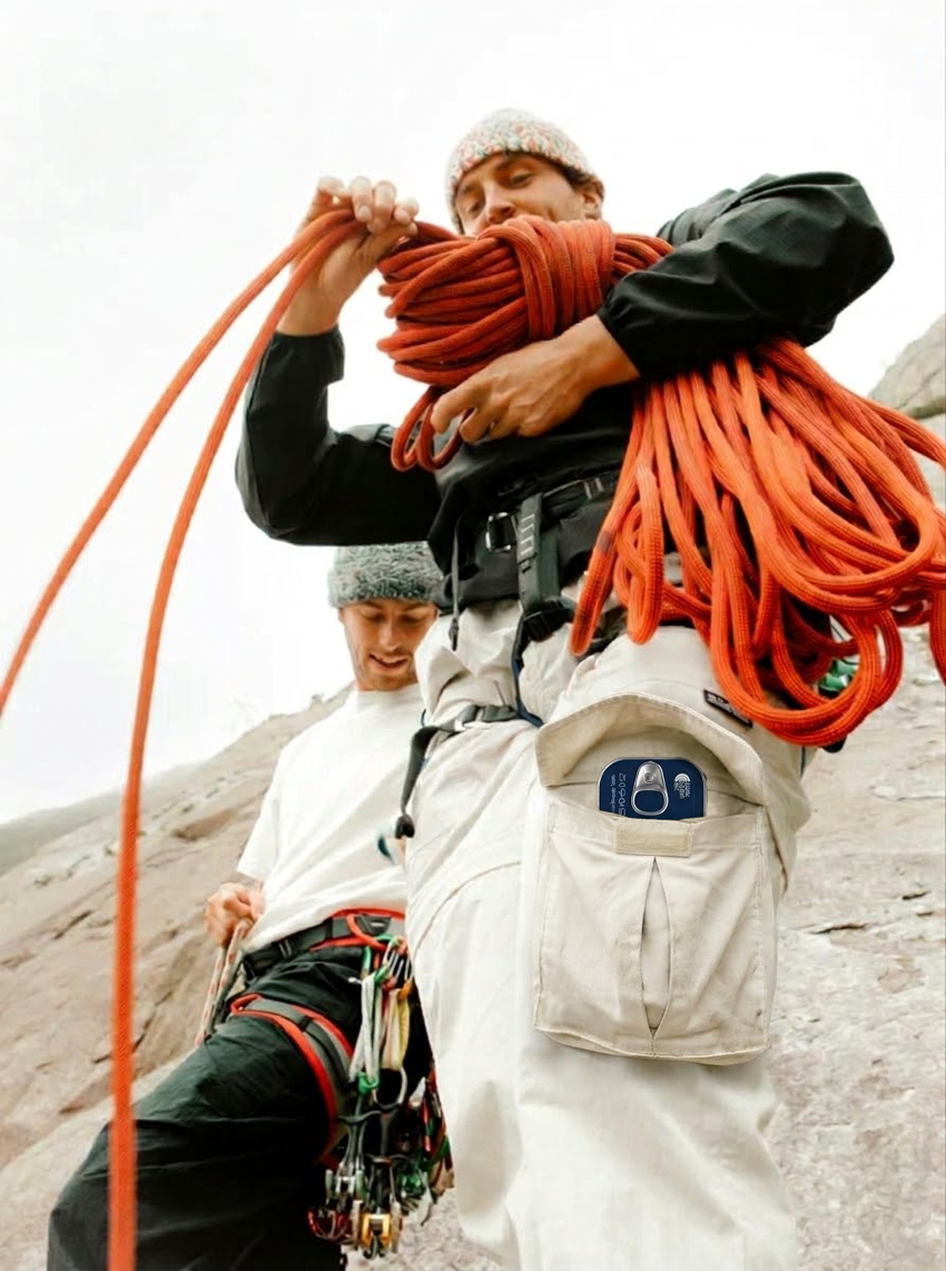 Climber on a rocky trail holding a North Taste canned good